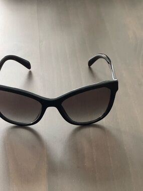 Prada Black tortoise Sunglasses. 
Original price $415. Beautiful sunglasses.